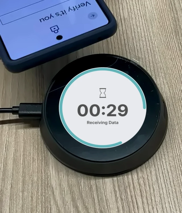 Tap2iD Go display shows a progress ring while it receives and checks the ID