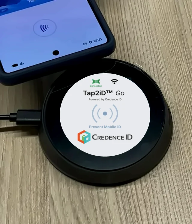 Customer taps a phone with a mobile driver’s license on Tap2iD Go