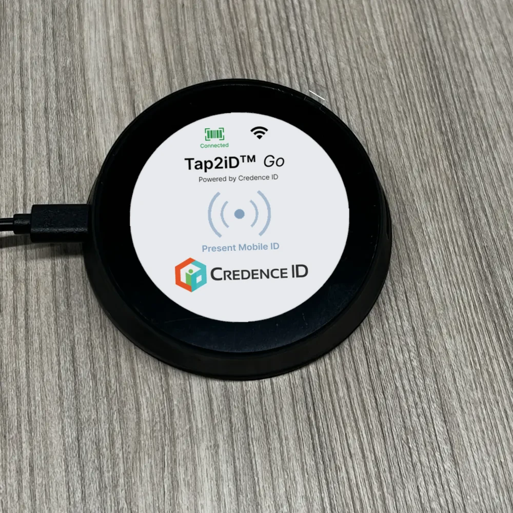 Tap2iD Go seen from above with its home screen lit
